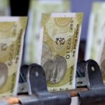 Rupee gains 10 paise to settle at 85.26 against U.S. dollar