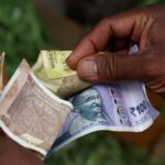 Rupee trades in narrow range against US dollar in early trade