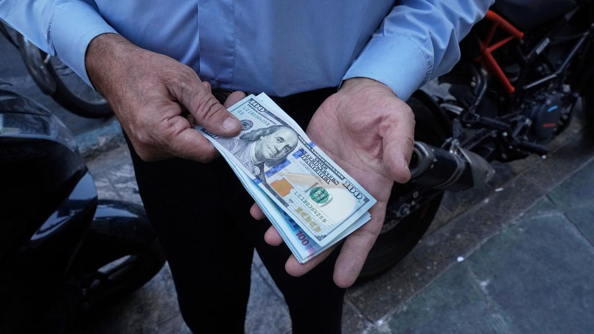 Iran’s currency falls to a new low as nuclear sanctions squeeze its ailing economy